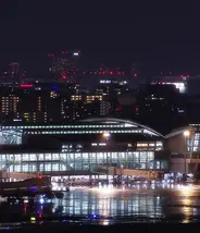 Fukuoka Airport International Terminal at night with Fukuoka City in the background Fukuoka Airport International Terminal at night with Fukuoka City in the background