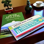 Voucher Japan Rail Pass on a table Voucher Japan Rail Pass on a table