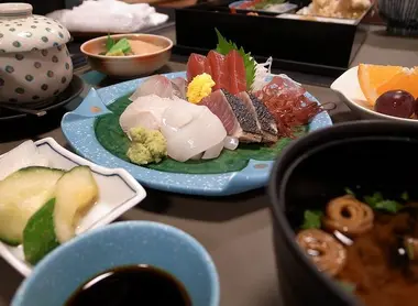 A Japanese meal featuring sashimi A Japanese meal featuring sashimi