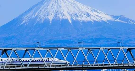 The Shinkansen bullet train going past Mount Fuji