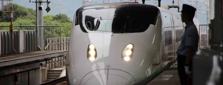 Shinkansen arriving at a station.